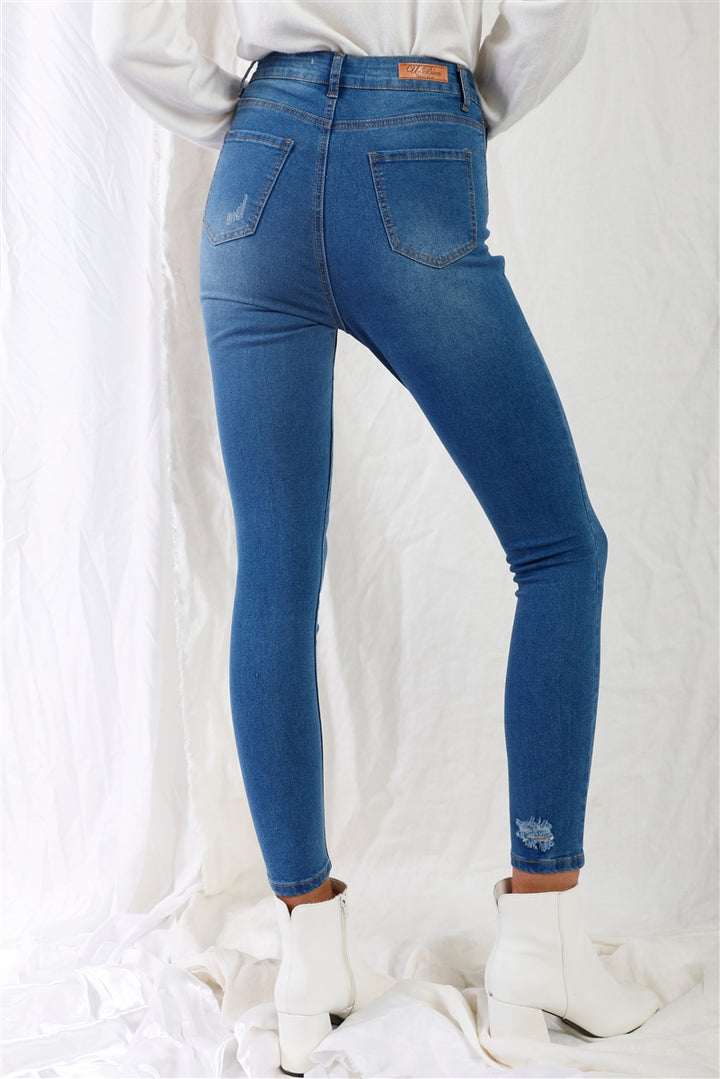 Mittelblaue Skinny-Jeans mit hoher Taille und Rissen